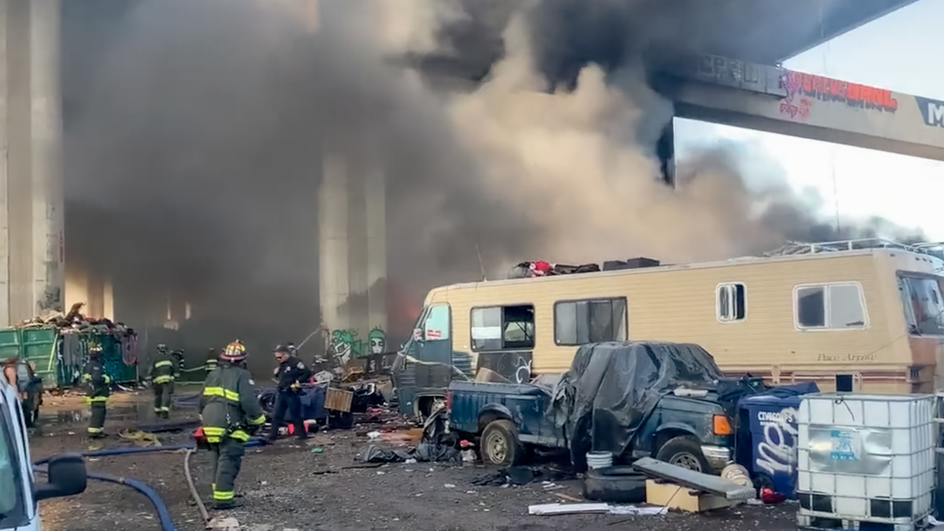 Numerous vehicles burned under an Oakland freeway Monday.