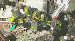 News chopper captures moment Detroit firefighter is pulled from the ruble.