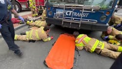 Stamford firefighters used airbags to lift the transit bus and rescue the woman and she was struck and trapped under the bus. Stamford firefighters used airbags to lift the transit bus and rescue the woman and she was struck and trapped under the bus.