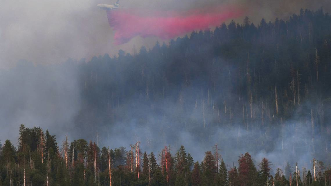 Flame retardant is dropped on a massive wildfire in Yosemite.