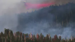 Flame retardant is dropped on a massive wildfire in Yosemite. Flame retardant is dropped on a massive wildfire in Yosemite.