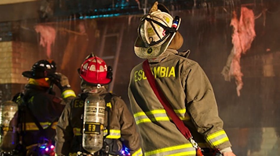 The fireground commander, or FGC, (right) used a thermal imager (TIC) to confirm extension and the overhang from a car fire. He then ordered the exterior tear and the interior to be opened up more and water to be applied based on exterior use.