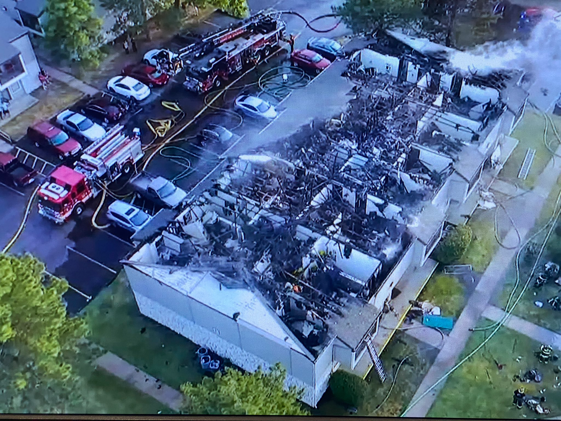 Drone footage shows the roof was burned off of the apartments on the second floor.