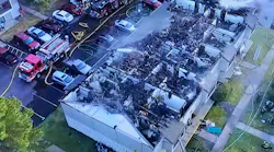 Drone footage shows the roof was burned off of the apartments on the second floor.