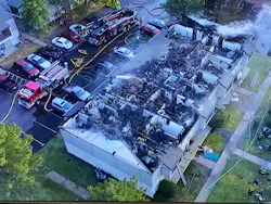 Drone footage shows the roof was burned off of the apartments on the second floor.