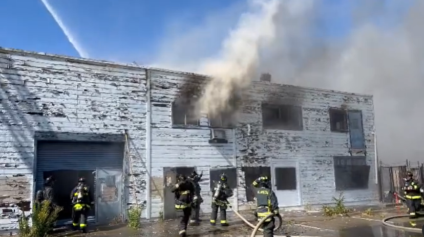 Crews found fire and smoke showing from the warehouse Monday afternoon.