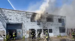 Crews found fire and smoke showing from the warehouse Monday afternoon.