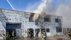 Crews found fire and smoke showing from the warehouse Monday afternoon.