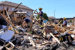 Balch Springs firefighters helped residents comb through debris for possessions. Balch Springs firefighters helped residents comb through debris for possessions.