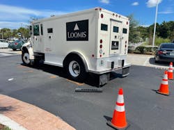 Firefighters said the Loomis truck struck the woman as she was walking across the parking lot. Firefighters said the Loomis truck struck the woman as she was walking across the parking lot.