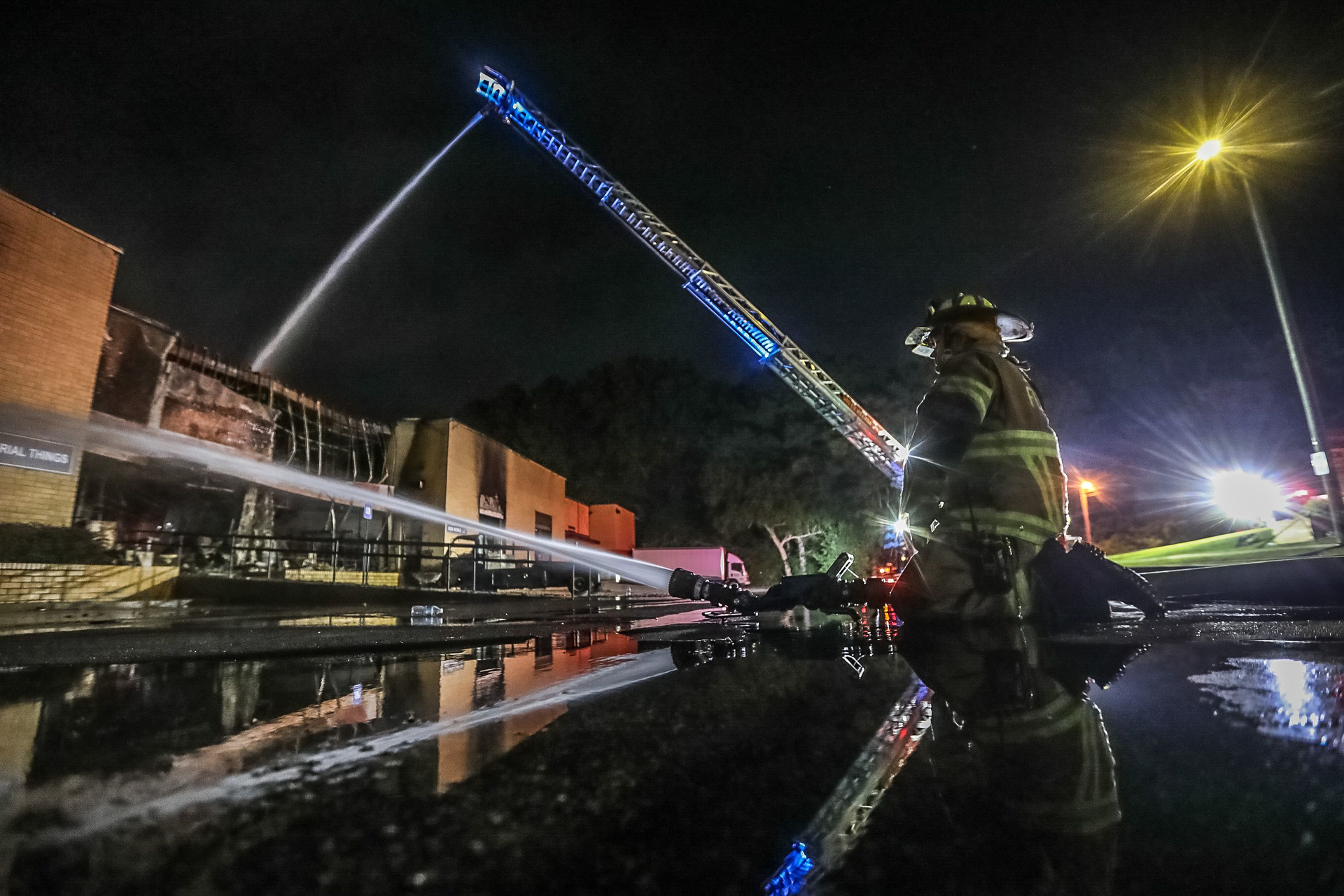Crews with the South Fulton Fire and Rescue Department aggressively attacked a fire in the Atlanta Custom Ironworks warehouse early Tuesday morning. The building houses oxygen and propane cannisters, as well as painting materials, fire Lt. Eric Jackson said. The cause of the fire remains under investigation.