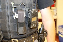 This officer carries their tourniquet forward of their weapon near the centerline of their tactical vest. In this case, it has been made more visible by including paramedic shears in the pouch. This officer carries their tourniquet forward of their weapon near the centerline of their tactical vest. In this case, it has been made more visible by including paramedic shears in the pouch.