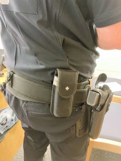 This officer carries their tourniquet to the rear of their weapon. In an active shooter situation, if this officer was wounded, they could actually be laying in a position that would make locating the tourniquet difficult. Note the white cross identifying this pouch as holding the tourniquet. This officer carries their tourniquet to the rear of their weapon. In an active shooter situation, if this officer was wounded, they could actually be laying in a position that would make locating the tourniquet difficult. Note the white cross identifying this pouch as holding the tourniquet.