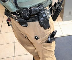 This officer is wearing a tactical vest and an equipment belt, but has chosen to carry their tourniquet in a pocket on their tactical pants. There are no identifying marks on the packet to indicate that the tourniquet is stored here. In an emergency, there could be a delay in locating this tourniquet. This officer is wearing a tactical vest and an equipment belt, but has chosen to carry their tourniquet in a pocket on their tactical pants. There are no identifying marks on the packet to indicate that the tourniquet is stored here. In an emergency, there could be a delay in locating this tourniquet.