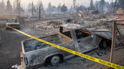 The Lincoln Heights neighborhood of Weed is cordoned off Saturday after the Weed Fire swept through the community.