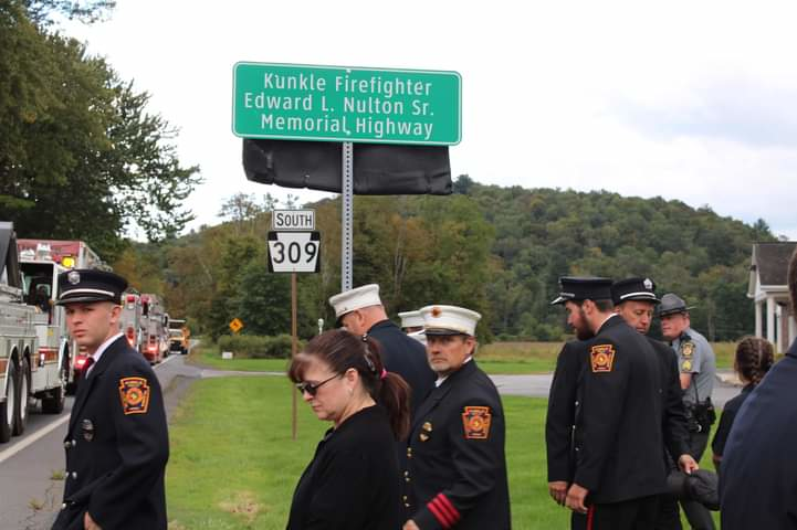 Firefighter Edward L. Nulton Sr. was struck on the opposite side of the road from this sign.