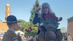 Traci Adams Swartz places roses at the entrance of National Fallen Firefighter Memorial early Sunday morning. Traci Adams Swartz places roses at the entrance of National Fallen Firefighter Memorial early Sunday morning.