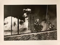 Jill Freedman captured this photo of Rescue 3 on the roof of a large tenement building.