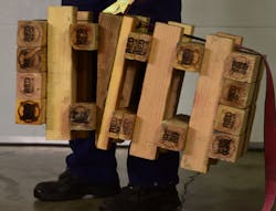 Photo 1. 30-inch cribbing assembly secured and carried horizontally. Note the wedges and the two-by-fours in the assembly. Photo 1. 30-inch cribbing assembly secured and carried horizontally. Note the wedges and the two-by-fours in the assembly.