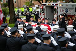 FDNY personnel salute as Capt. Alison Russo's casket is removed from the ambulance. FDNY personnel salute as Capt. Alison Russo's casket is removed from the ambulance.