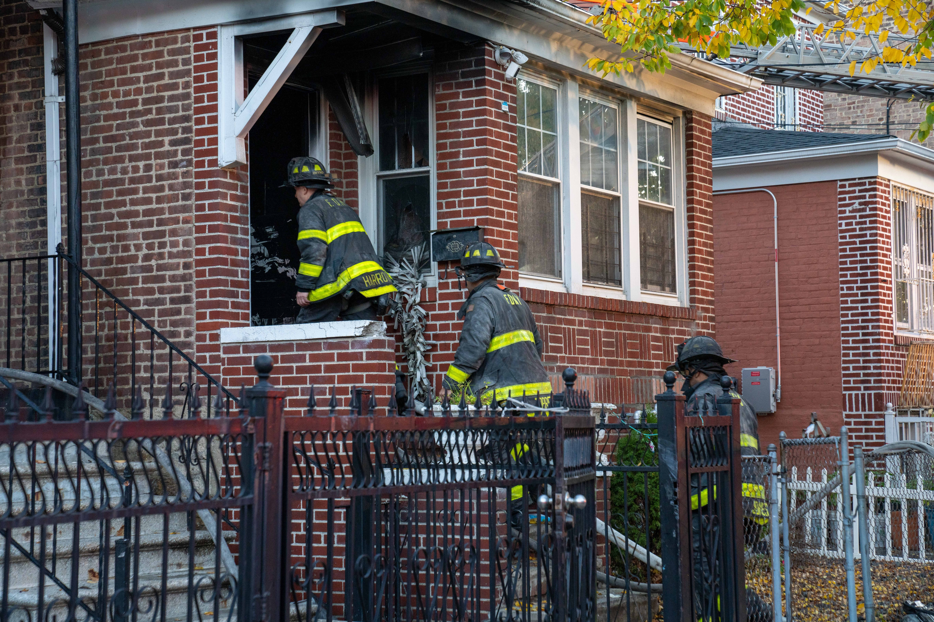Firefighters perform overhaul at the house.