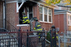Firefighters perform overhaul at the house. Firefighters perform overhaul at the house.