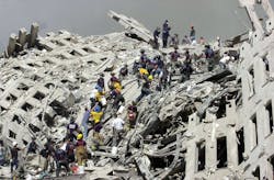 Firefighters work on the pile of the World Trade Center. Firefighters work on the pile of the World Trade Center.