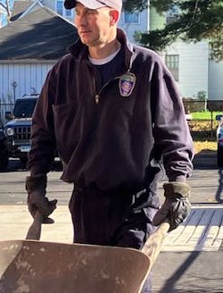 A Hartford firefighter gets ready to haul mulch. A Hartford firefighter gets ready to haul mulch.