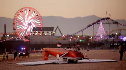 An investigation in underway as a single-engine Cessna airplane flipped over after the pilot landed on the beach south of the pier on Thursday, Dec. 22, 2022, in Santa Monica, California. Both occupants were rescued and transported to a hospital.