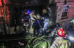 An Atlanta firefighter slipped into a hole at a house fire. An Atlanta firefighter slipped into a hole at a house fire.
