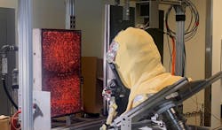 SCBA facepiece being exposed to radiant heat flux from a natural-gas fired panel. SCBA facepiece being exposed to radiant heat flux from a natural-gas fired panel.