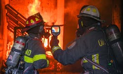 Working with crews sometimes can be more exciting than simply reviewing policies or talking tactics. Here a chief and a company officer review thermal imaging use in a live fire environment. Working with crews sometimes can be more exciting than simply reviewing policies or talking tactics. Here a chief and a company officer review thermal imaging use in a live fire environment.