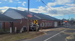 The truck hit posts near the firehouse.