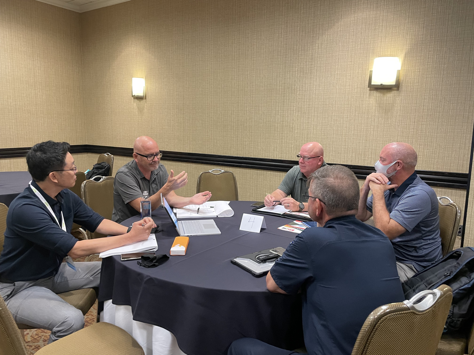 Brian Harris, TCA Architecture, (second from left) meets with a fire department during a 1-on-One pre-conference session.