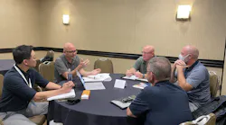 Brian Harris, TCA Architecture, (second from left) meets with a fire department during a 1-on-One pre-conference session.