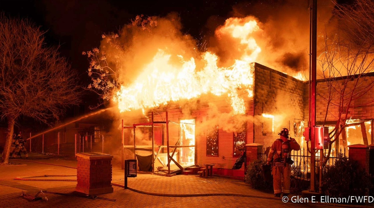 The fire spread to adjoining structures.