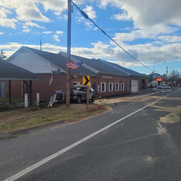 The truck hit posts near the firehouse. The truck hit posts near the firehouse.