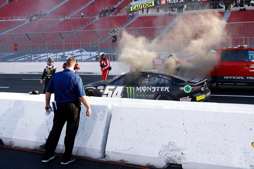 Driver Ty Gibbs (54) exits his after an on-track incident during practice for the NASCAR Clash at the Coliseum at Los Angeles Coliseum.