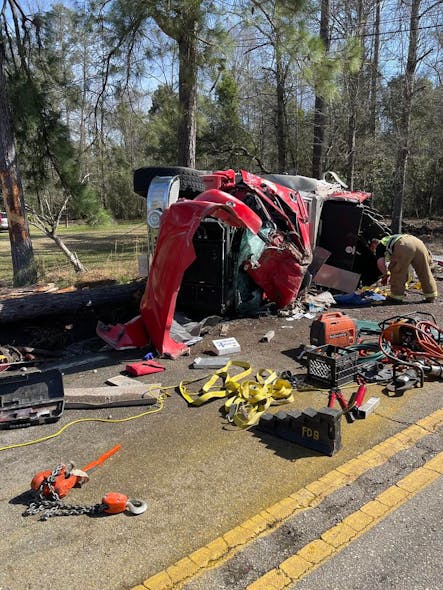 The driver was pinned in the wreckage.