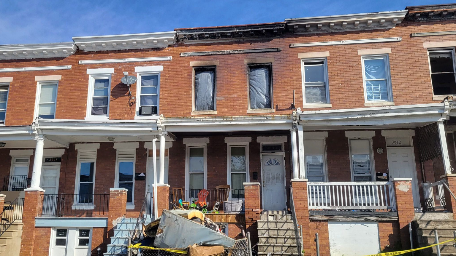 Firefighters pulled five people from this burning rowhome in Baltimore early Saturday.