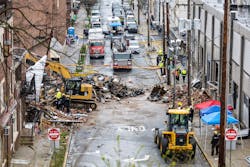 The explosion littered streets surrounding the factory with debris. The explosion littered streets surrounding the factory with debris.