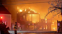Homes burn during a five-alarm fire in the Minot beach section of Scituate Friday night.