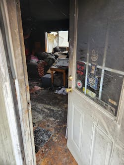 With a report of occupants trapped, the crew of Goshen Township Fire &amp; EMS Engine 19 entered through the front door and pushed toward the fire in the rear of the mobile home. Quite a bit of furniture that was in their path made it difficult for them to maneuver.