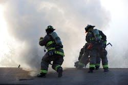 The firefighter on the left is identified as “L12” and with his name on the coat, with first initial before last name, because his son is on the job, too. Unfortunately, the firefighter at right doesn’t have his name on his coat. The firefighter on the left is identified as “L12” and with his name on the coat, with first initial before last name, because his son is on the job, too. Unfortunately, the firefighter at right doesn’t have his name on his coat.