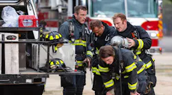 Boise firefighters take a break during a fire.