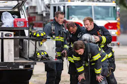 Boise firefighters take a break during a fire. Boise firefighters take a break during a fire.