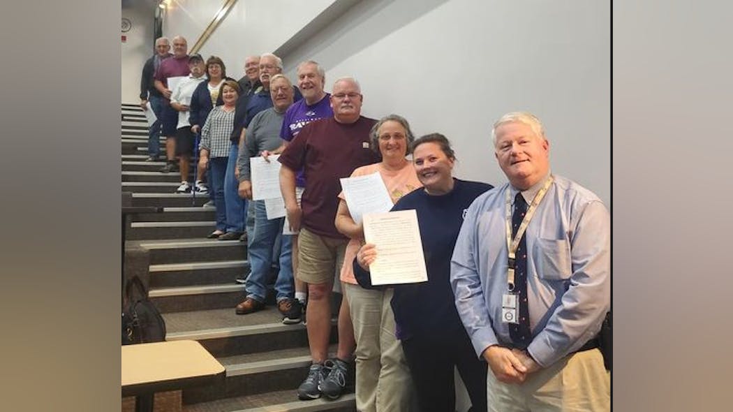 Carroll County, MD Fire & EMS Director Michael Robinson, forefront, stands with volunteers recently. Carroll County, MD Fire & EMS Director Michael Robinson, forefront, stands with volunteers recently.
