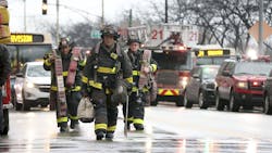 With elevators inoperable, Chicago firefighters had to haul gear up to the 27th floor. With elevators inoperable, Chicago firefighters had to haul gear up to the 27th floor.