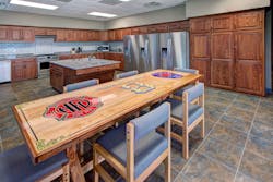 Firefighter-made elements, such as the custom kitchen table in the Harrisburg, NC, Fire Department Station No. 3, combine a department&rsquo;s history and member talents.