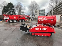 The fire brigade in Austria is equipped with multiple specialty vehicles and pieces of equipment tailored for their various response needs. In the foreground, a Luf 60 fire robot is used to fires in industrial facilities and the regions automobile tunnels. The industrial rescue crane in the background is used to remove heavy vehicles from roadway among other incidents.